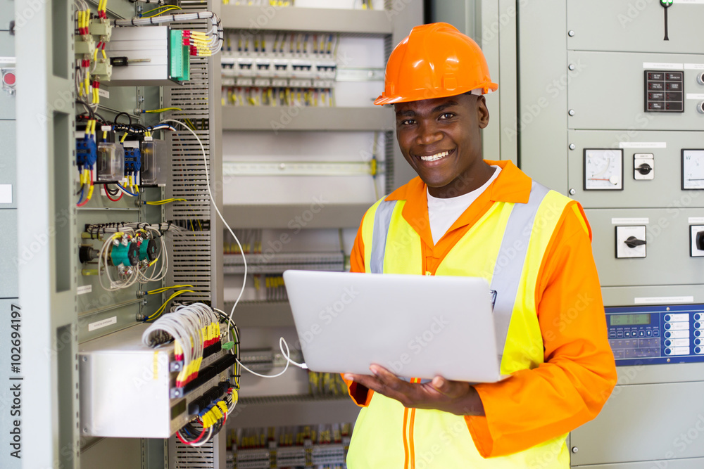 A male engineer smiling